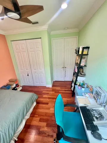 a bedroom with bed and a window