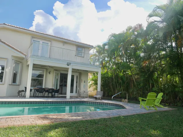 a view of a house with a yard porch and sitting area
