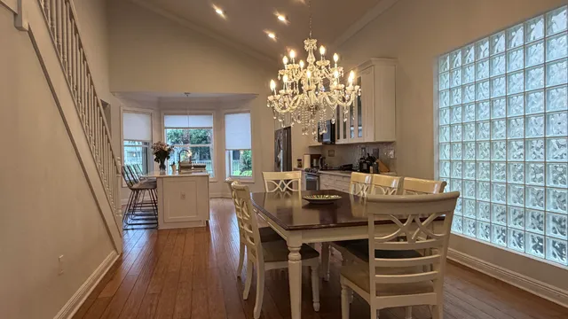 a view of a dining room with furniture window and wooden floor