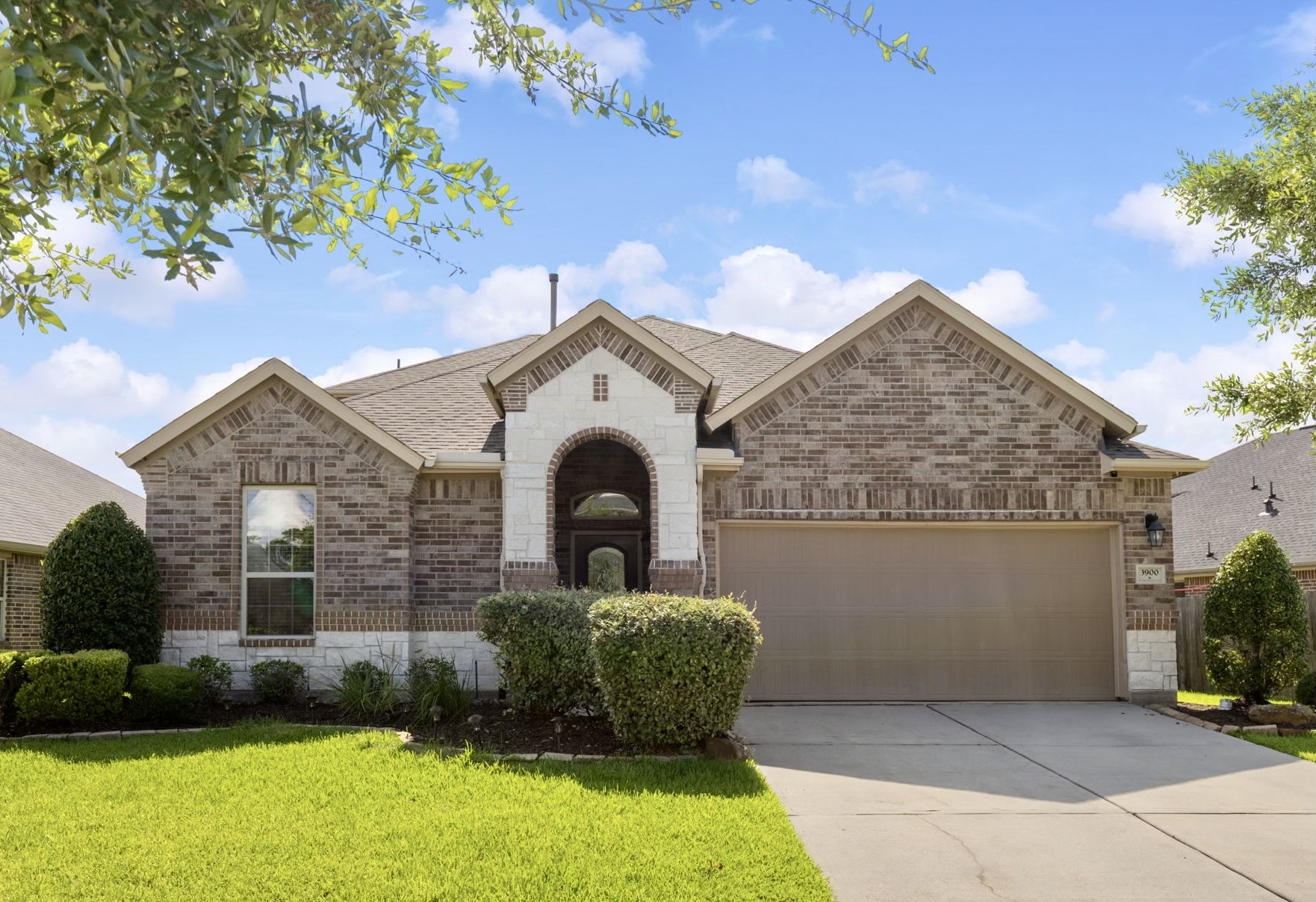 3900 Enchanted Timbers Lane Spring, TX 77386 - Photo 1 of 49 a front view of a house with garden