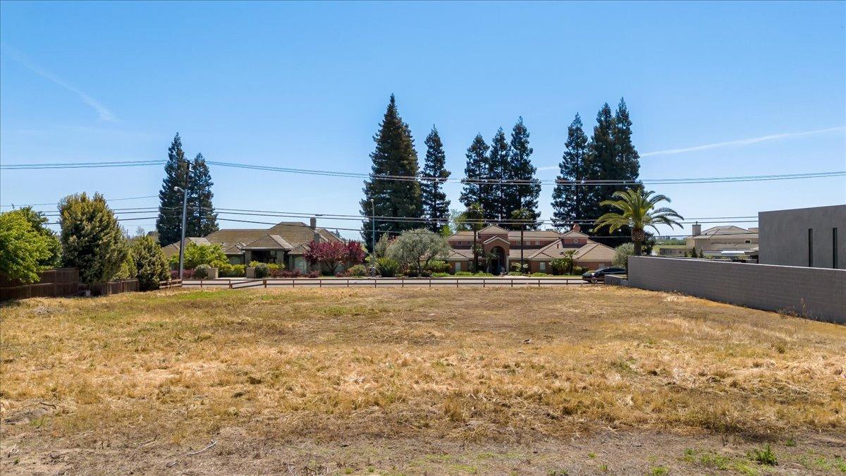 0 Country Club Drive Modesto, CA 95356 - Photo 13 of 30 a tall yellow house with trees in the background