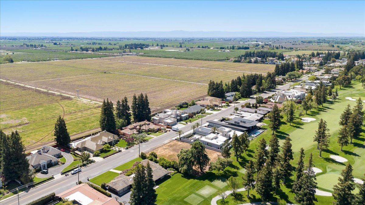 0 Country Club Drive Modesto, CA 95356 - Photo 19 of 30 an aerial view of a city with lots of residential buildings ocean and mountain view in back
