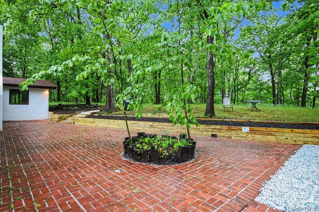 18 Hillside View Road Mahopac, NY 10541 - Photo 6 of 42 a view of a swimming pool with a patio