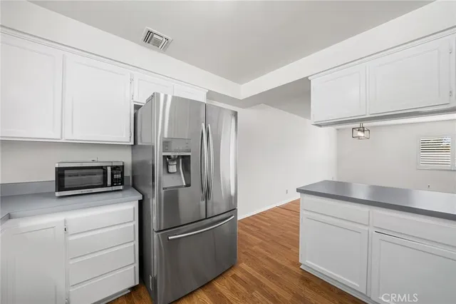 a kitchen with appliances and cabinets