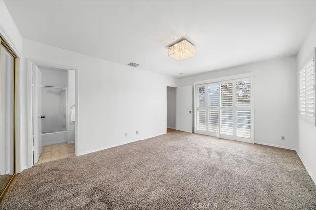 a bathroom with a sink and mirror with toilet