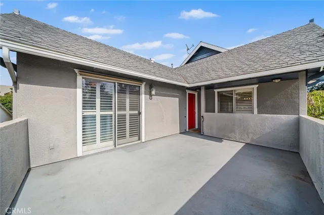 a view of backyard with large windows