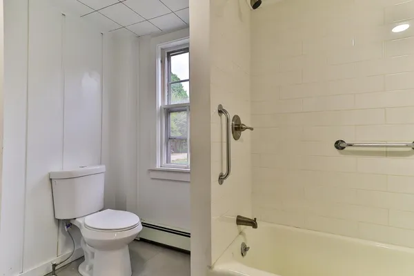 a utility room with sink dryer and washer