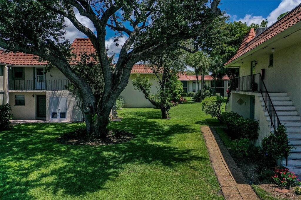 1124 Northwest 13th Street, Unit 120A Boca Raton, FL 33486 - Photo 16 of 22 a view of backyard with green space