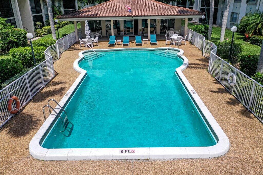 1124 Northwest 13th Street, Unit 120A Boca Raton, FL 33486 - Photo 19 of 22 an outdoor space with patio