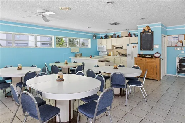 a room with furniture pool table and window
