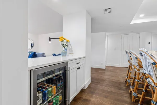 a view of cabinets with wooden floor and furniture