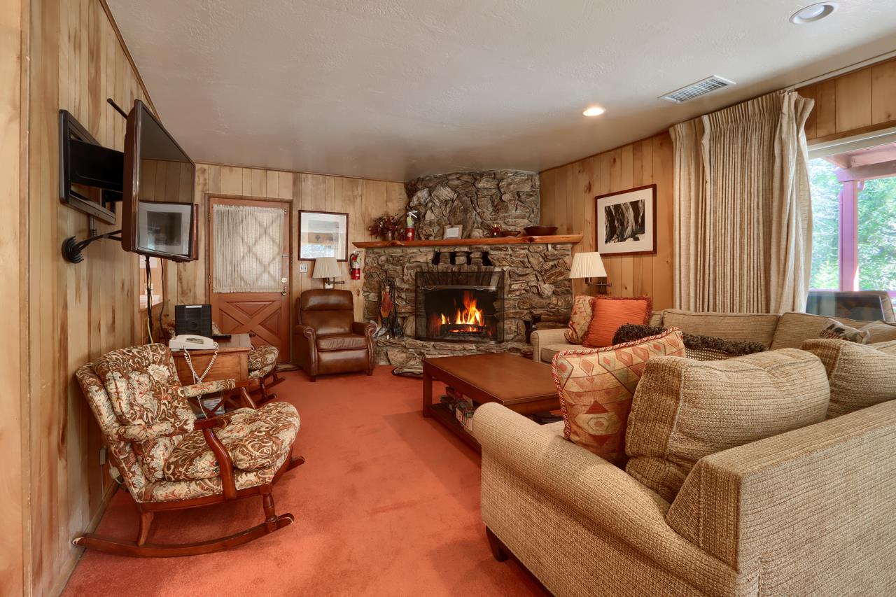 2580 River Road Wawona, CA 95389 - Photo 2 of 5 a living room with furniture and a fireplace