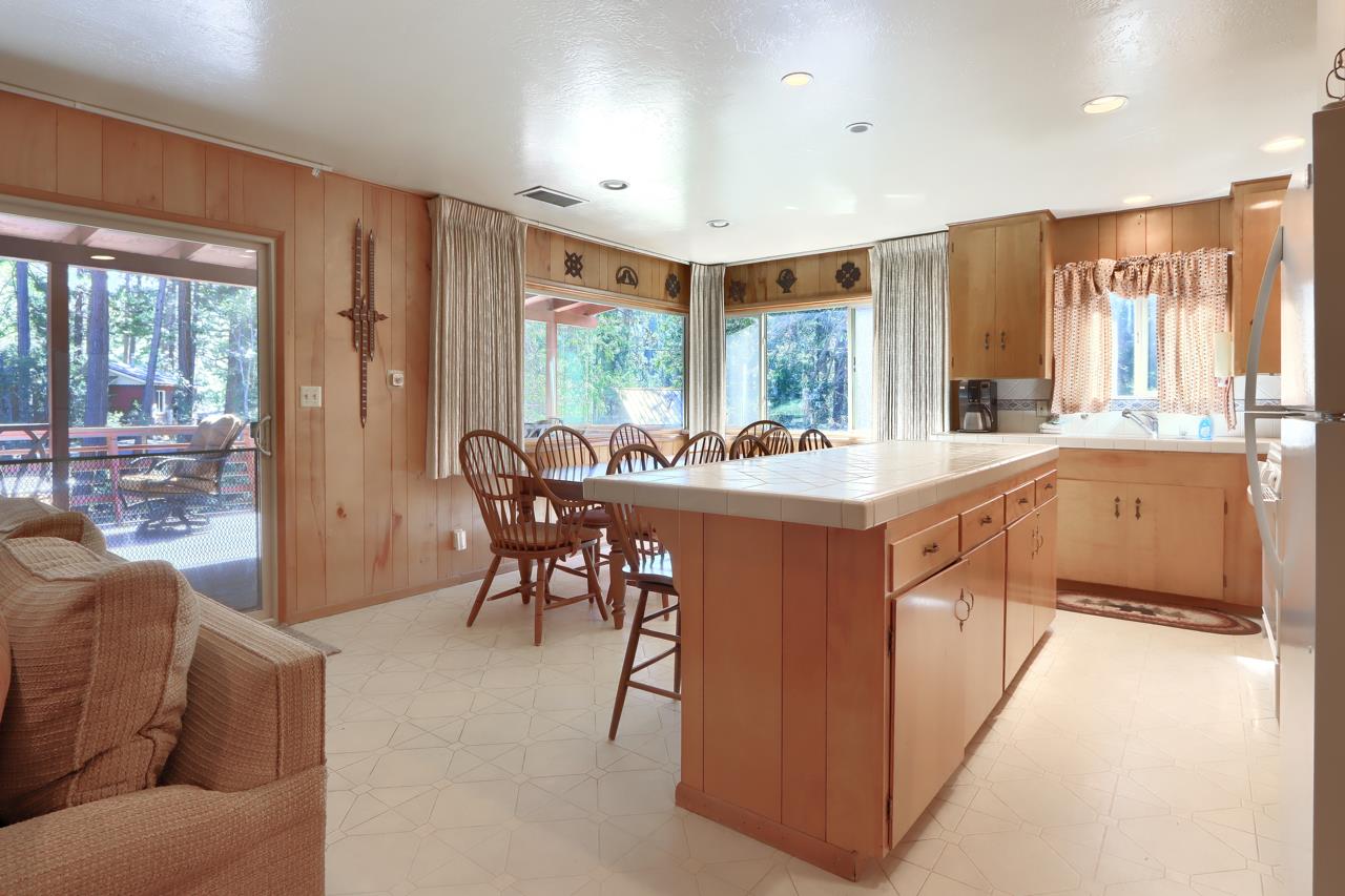 2580 River Road Wawona, CA 95389 - Photo 5 of 5 a dining hall with stainless steel appliances granite countertop a stove a sink and a refrigerator