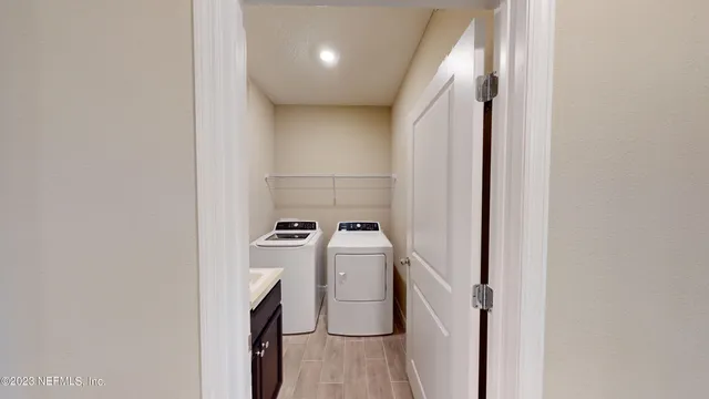 a utility room with dryer and washer