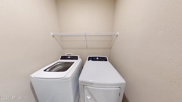 a utility room with dryer and washer