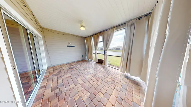 a view of a bathroom with sink and wooden floor