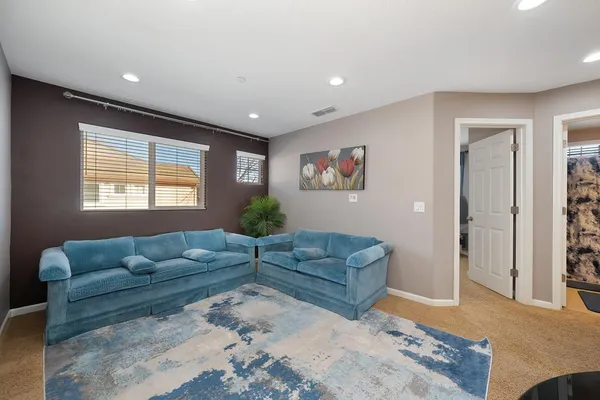 a living room with furniture window and rug
