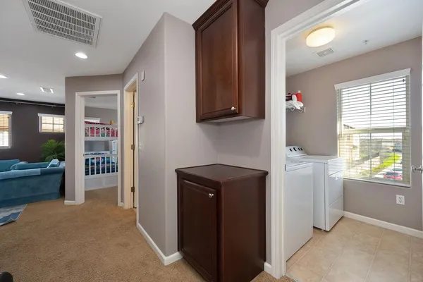 a kitchen with a refrigerator and a stove