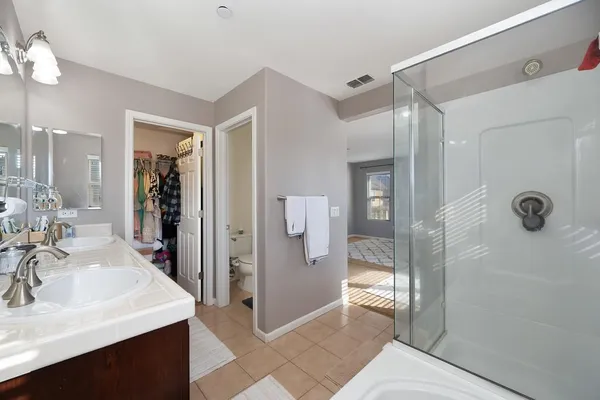 a bathroom with a sink and mirror