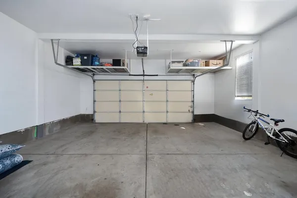a kitchen with a sink cabinets and appliances
