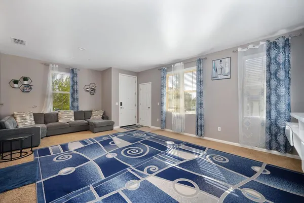 a living room with furniture and a window