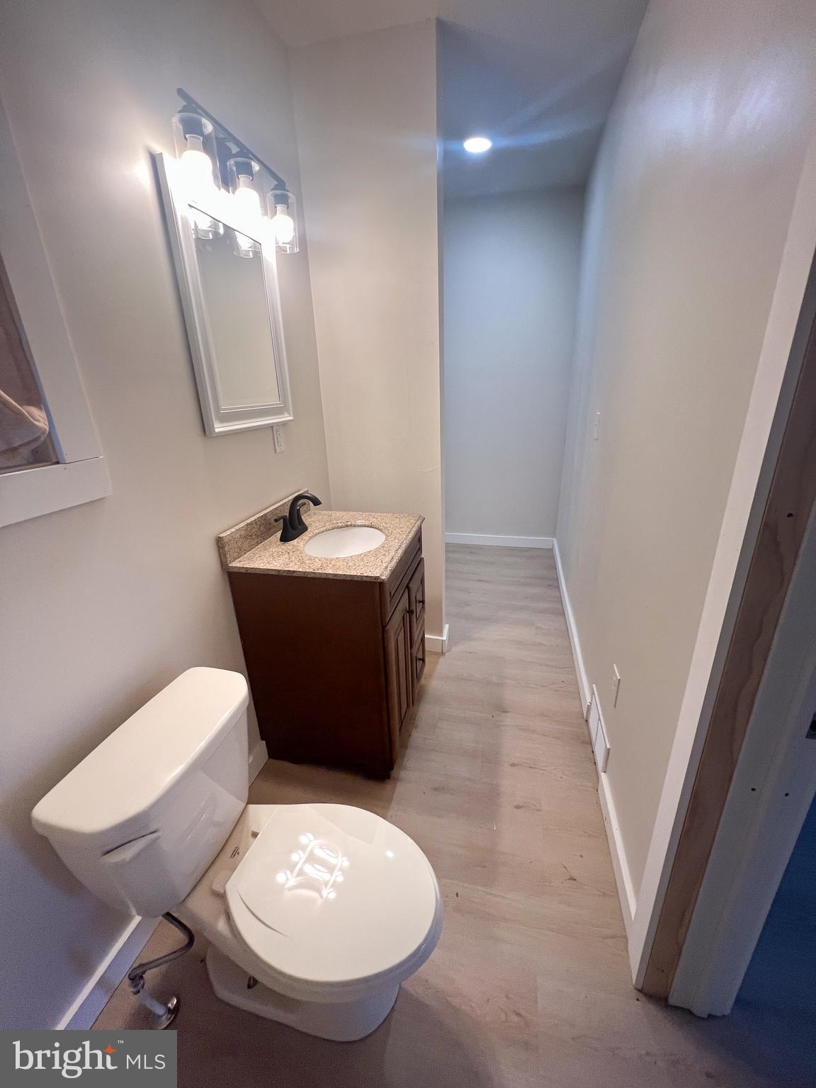 119 South Walnut Street Lewistown, PA 17044 - Photo 11 of 29 a bathroom with a toilet sink and mirror