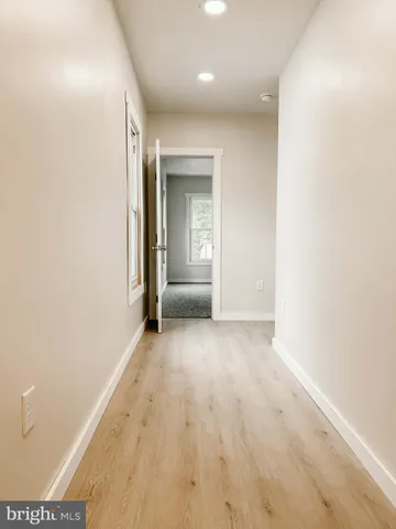 a view of empty room with windows