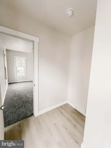 a view of empty room with windows