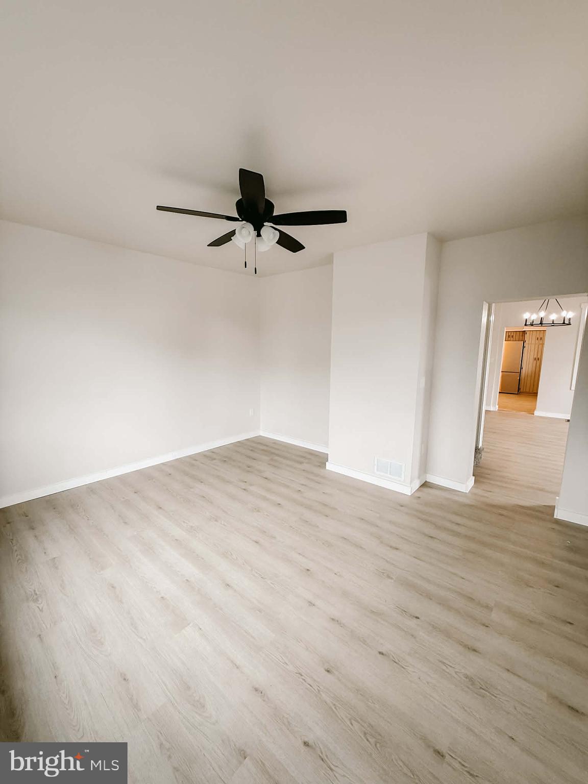 119 South Walnut Street Lewistown, PA 17044 - Photo 17 of 29 a view of a room with wooden floor and ceiling fan