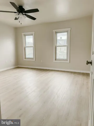 a view of a yard with a snow on the road