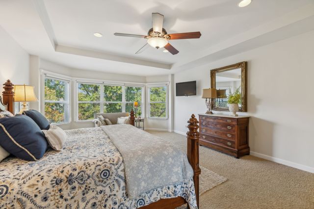 a bed room with a bed and a window