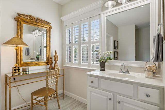 a bathroom with a sink double vanity and a mirror