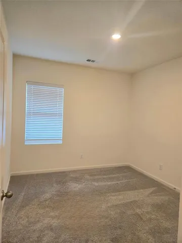 a bathroom with a toilet and a bathtub