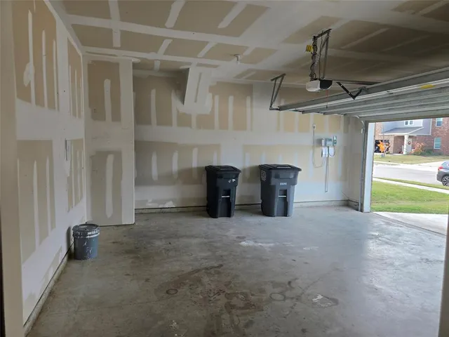 a kitchen with stainless steel appliances granite countertop a sink a stove top oven a granite counter space and cabinets