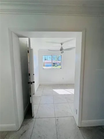 a bathroom with a granite countertop sink and a toilet