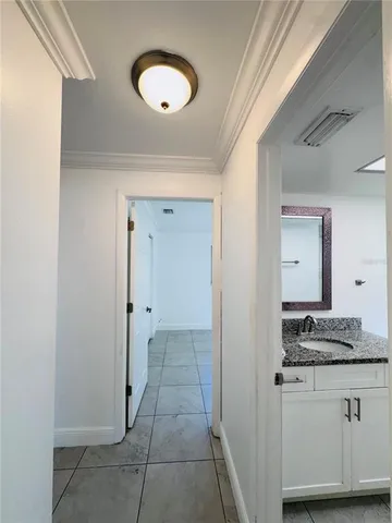 a view of a swimming pool with a bench in front of it