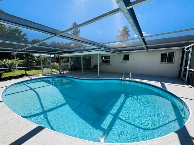 a backyard of a house with outdoor seating