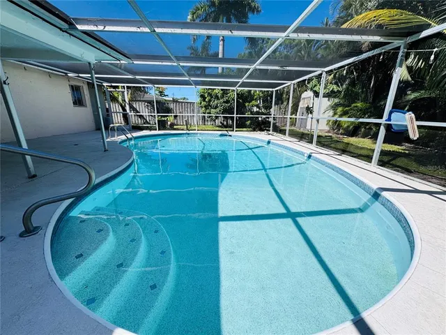 a view of a garden with large trees
