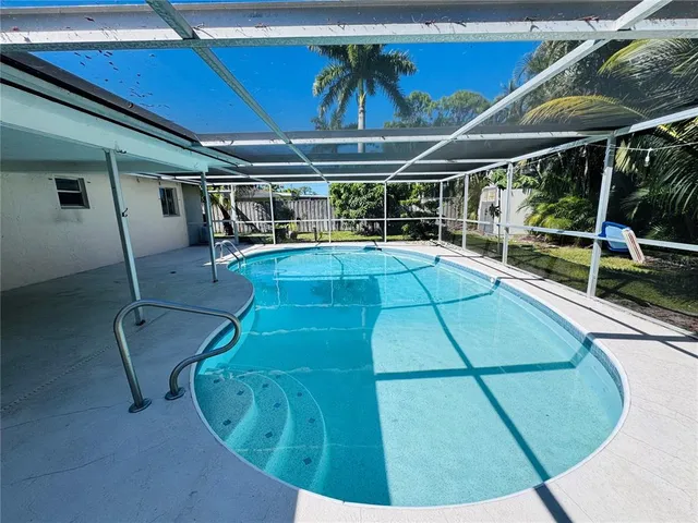 a view of a chair and tables in the garden