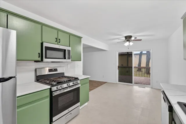 a kitchen with granite countertop a stove and a sink
