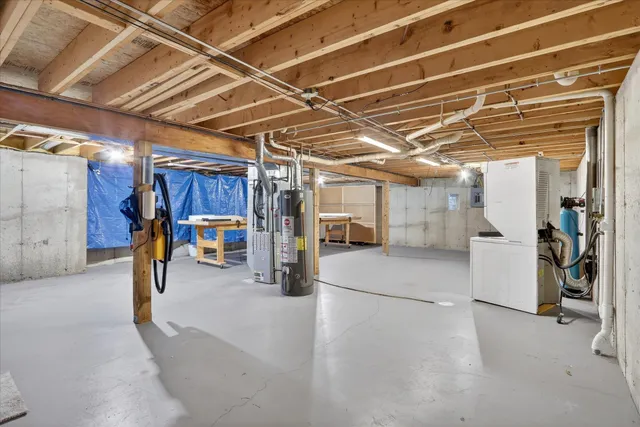 a view of empty room with refrigerator