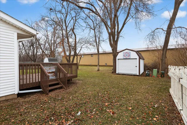 a view of yard with tree in the background