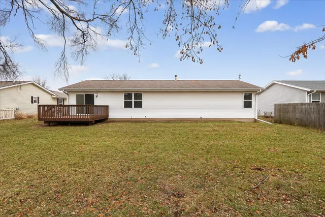 a view of an house with backyard space and garden