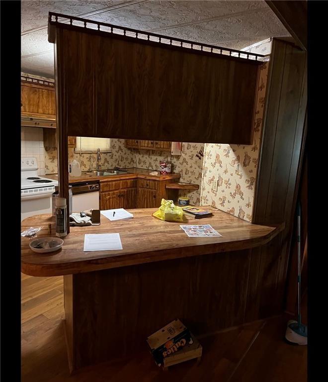 85 Honeysuckle Drive Southwest Cartersville, GA 30120 - Photo 11 of 22 a kitchen with a sink and cabinets