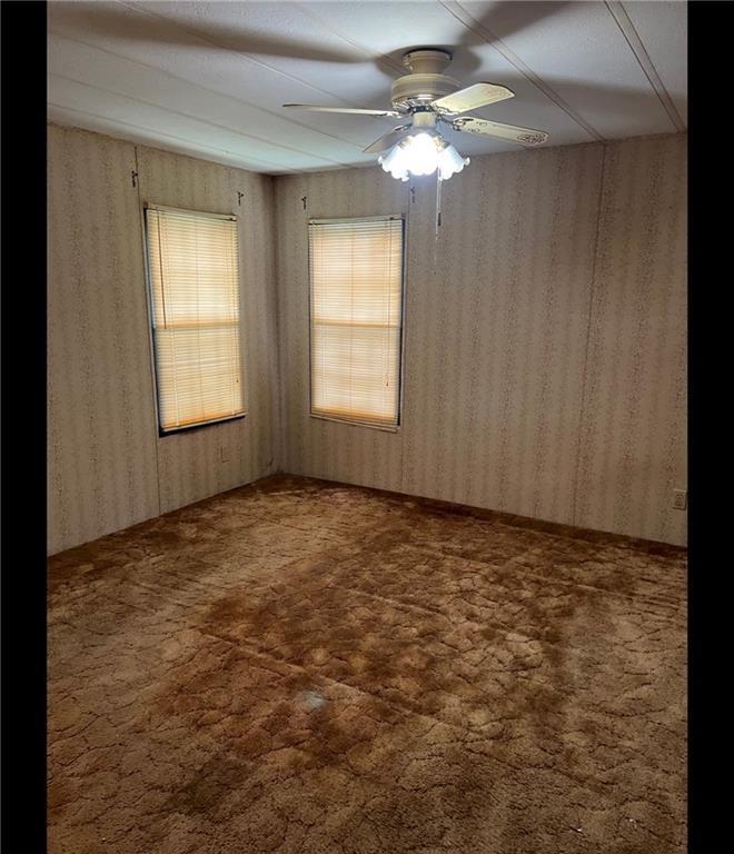 85 Honeysuckle Drive Southwest Cartersville, GA 30120 - Photo 17 of 22 an empty room with windows and fan