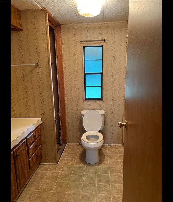 85 Honeysuckle Drive Southwest Cartersville, GA 30120 - Photo 18 of 22 a bathroom with a toilet and a sink