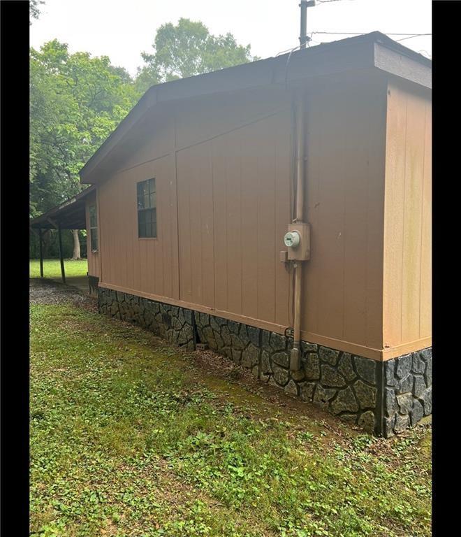 85 Honeysuckle Drive Southwest Cartersville, GA 30120 - Photo 2 of 22 a backyard of a house