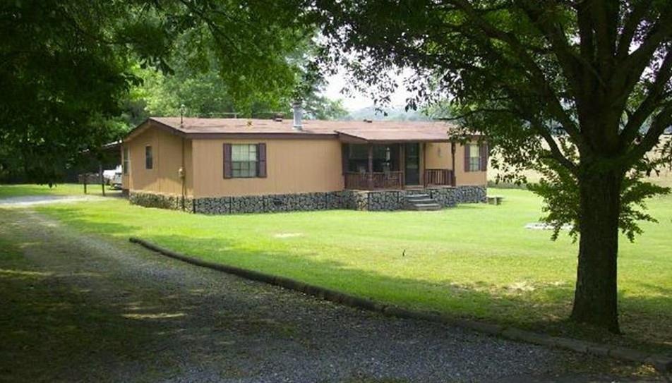 85 Honeysuckle Drive Southwest Cartersville, GA 30120 - Photo 22 of 22 a view of a house with backyard and a tree