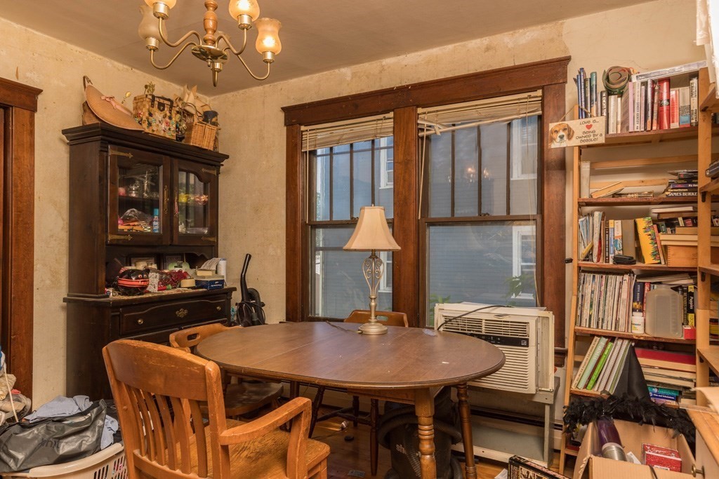 171 Sherman Street Gardner, MA 01440 - Photo 3 of 10 a view of a dining room with furniture and a chandelier