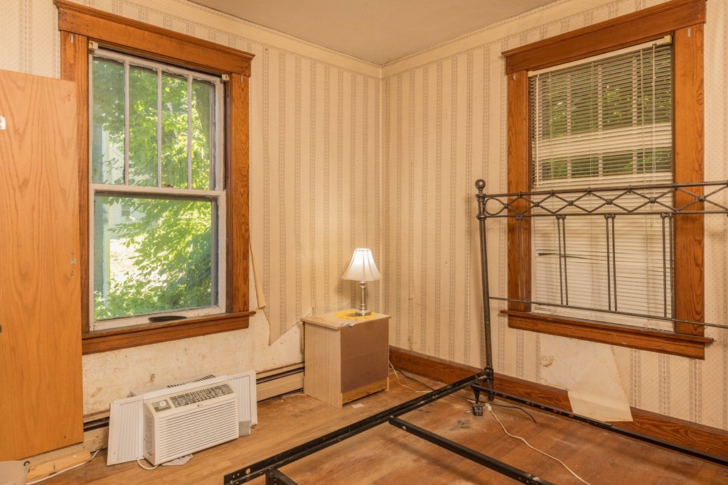 171 Sherman Street Gardner, MA 01440 - Photo 5 of 10 a living room with a table chairs and windows